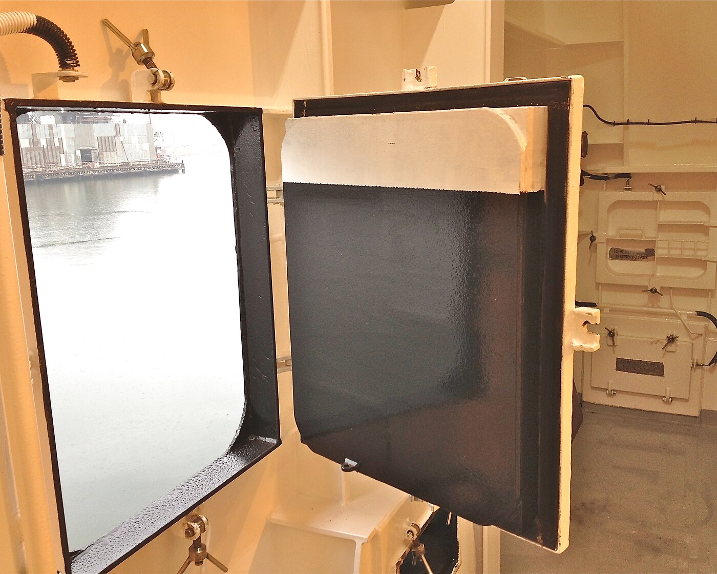 Open marine access hatch door on a vessel