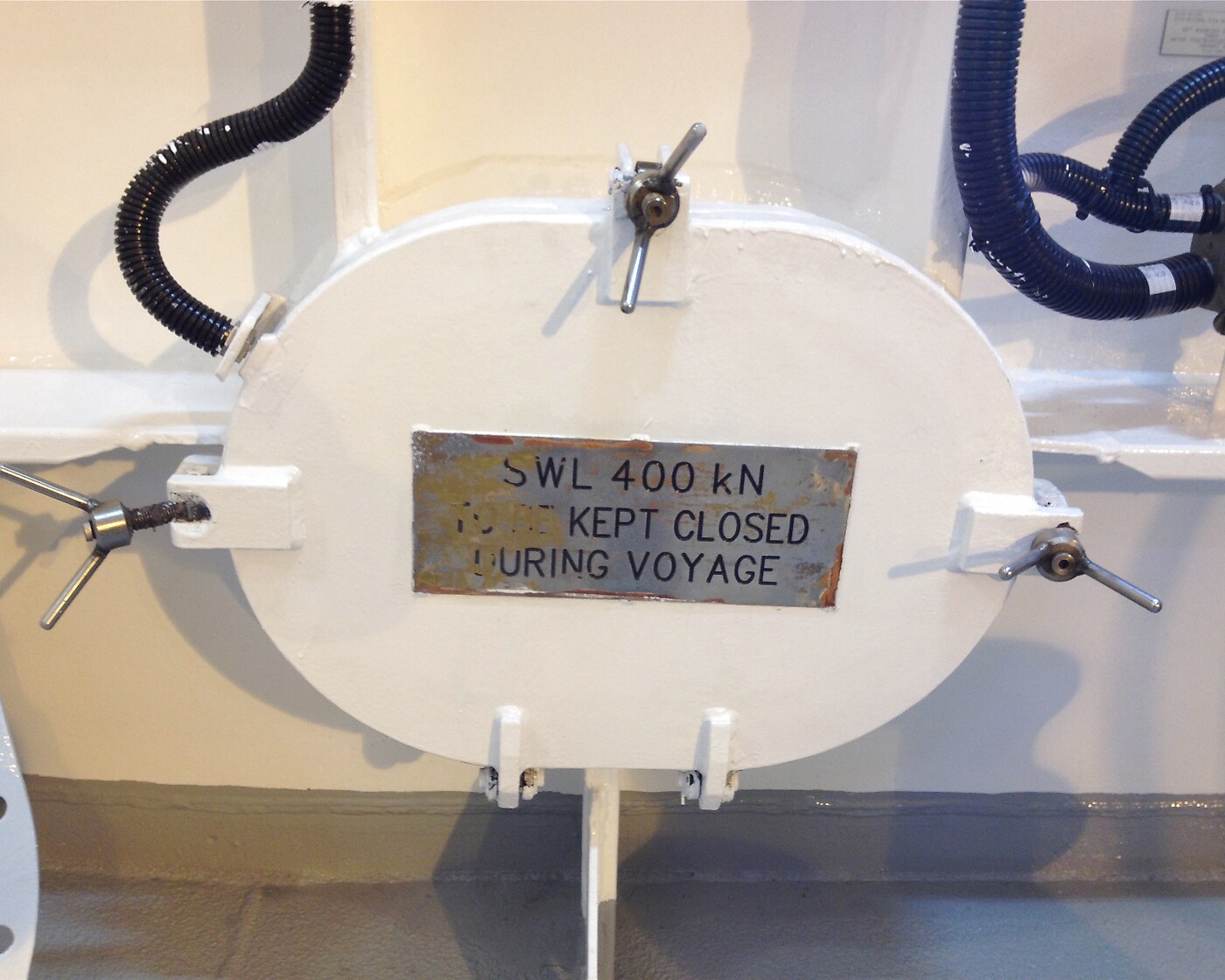 Oval watertight marine hatch with eye-bolt closure and SWL rating plate