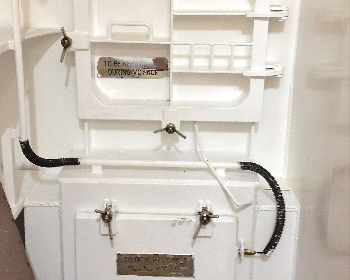 Closed watertight marine hatch on a ship bulkhead