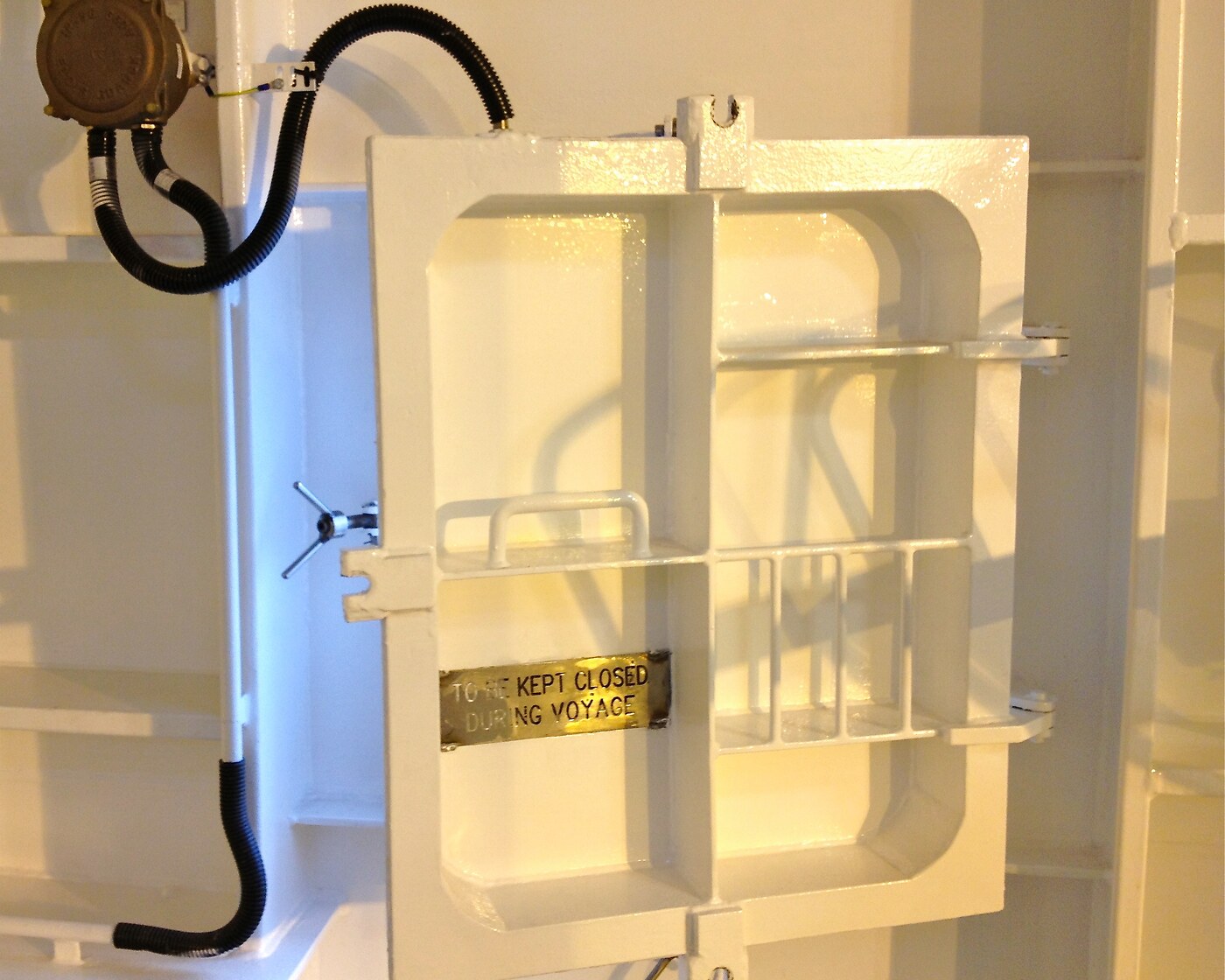 Marine access hatch on a ship bulkhead