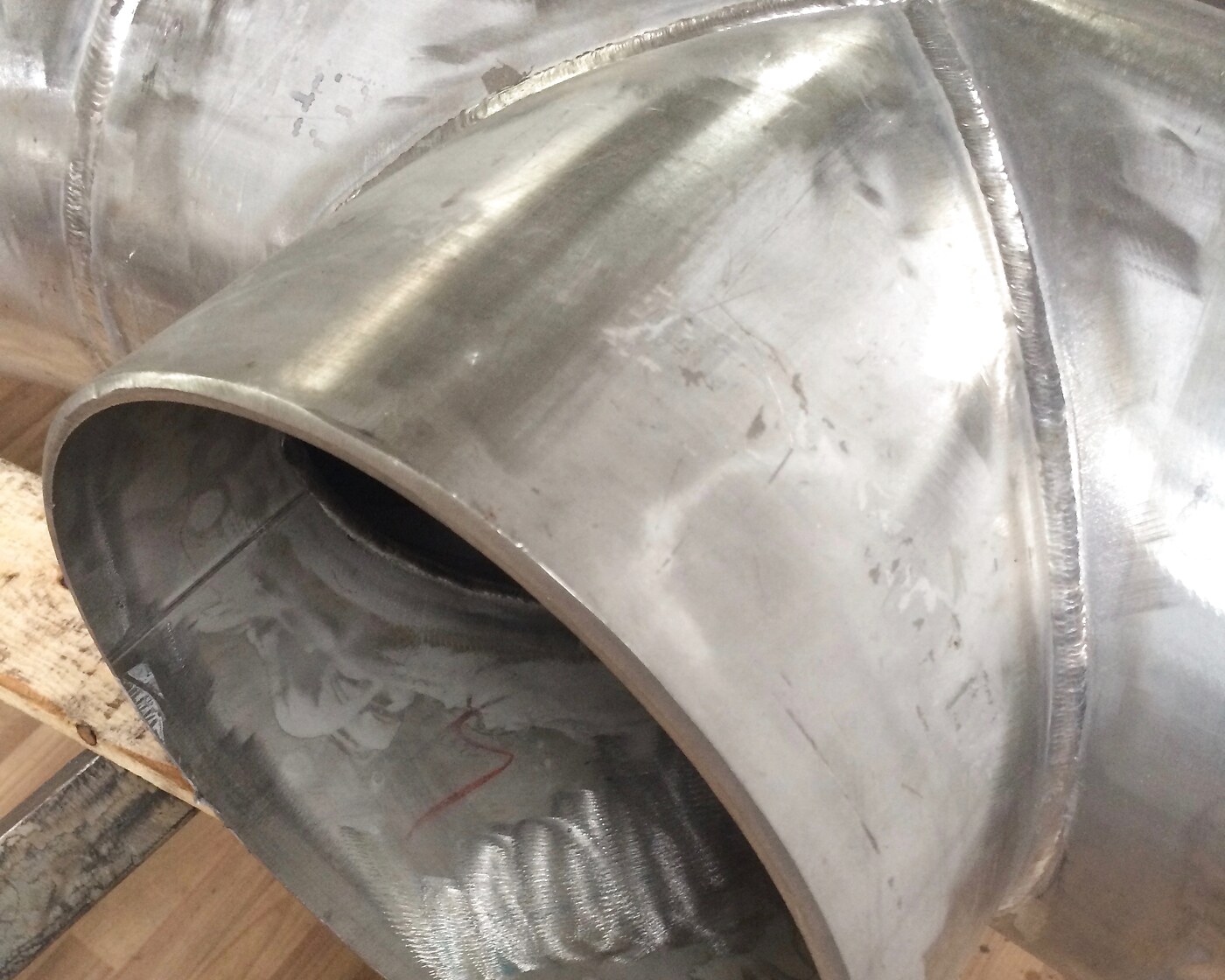 Large stainless-steel pipe elbow reducer with flared end
